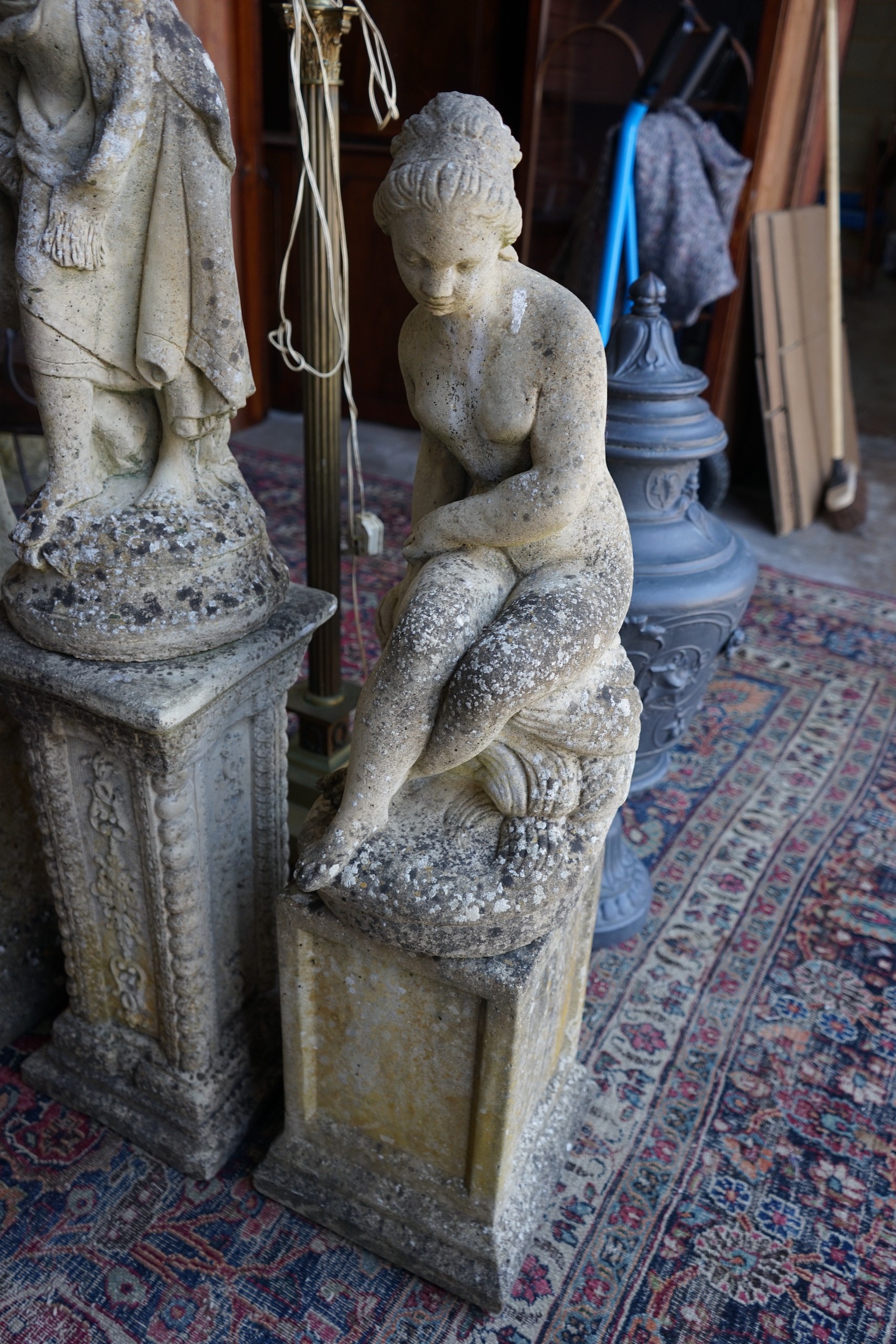 Four reconstituted stone garden statues, largest height 124cm